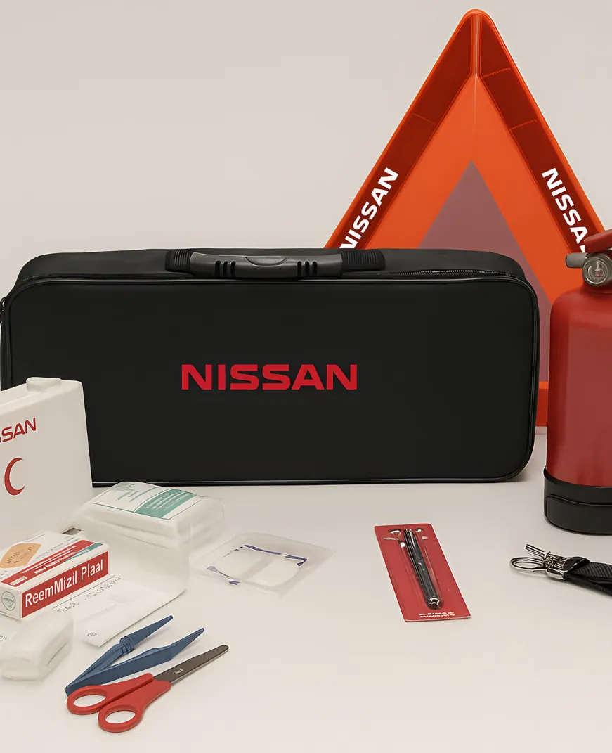 Nissan-branded car safety kit bag with warning triangle, fire extinguisher and first-aid supplies