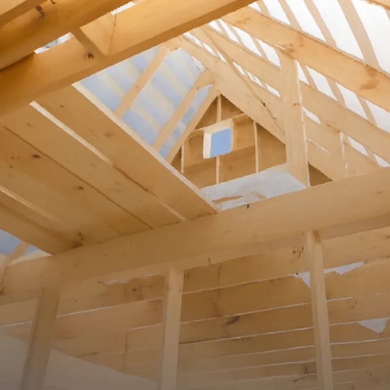 Timber roof trusses under construction