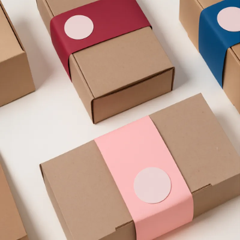 Kraft boxes with colored paper sleeves and seals